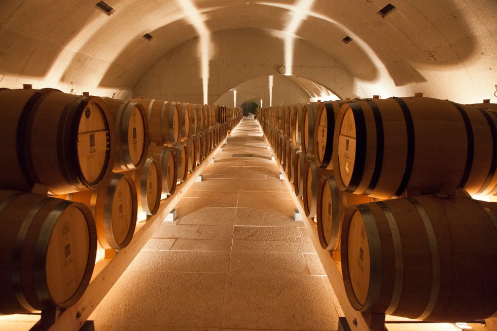 portugal, douro valley, peso da regua this is the barrel room of quinta do vallado, one of the oldest and most famous quintas of the douro valley, built in 1716 it lies on the river corgo, a tributary of the douro river, right next to the mouth, near the town of peso da ruler for nearly 200 years the quinta do vallado had as its main activity the production of port wines