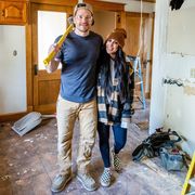 man and woman renovating house