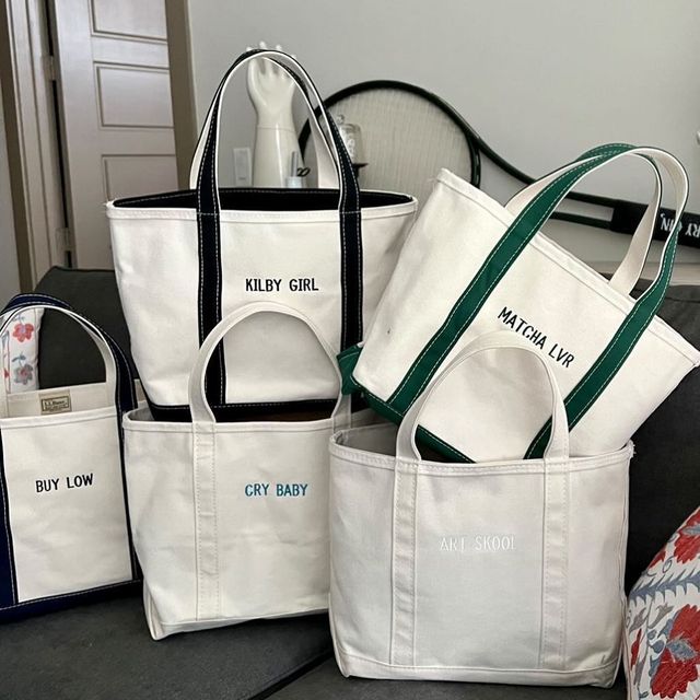 a pile of totes from the ll bean ironic boat and tote instagram account