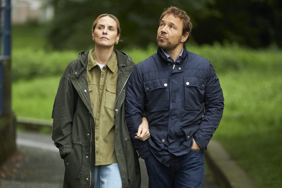 a couple walking together outdoors