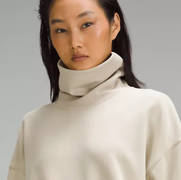a woman wearing a white sweater