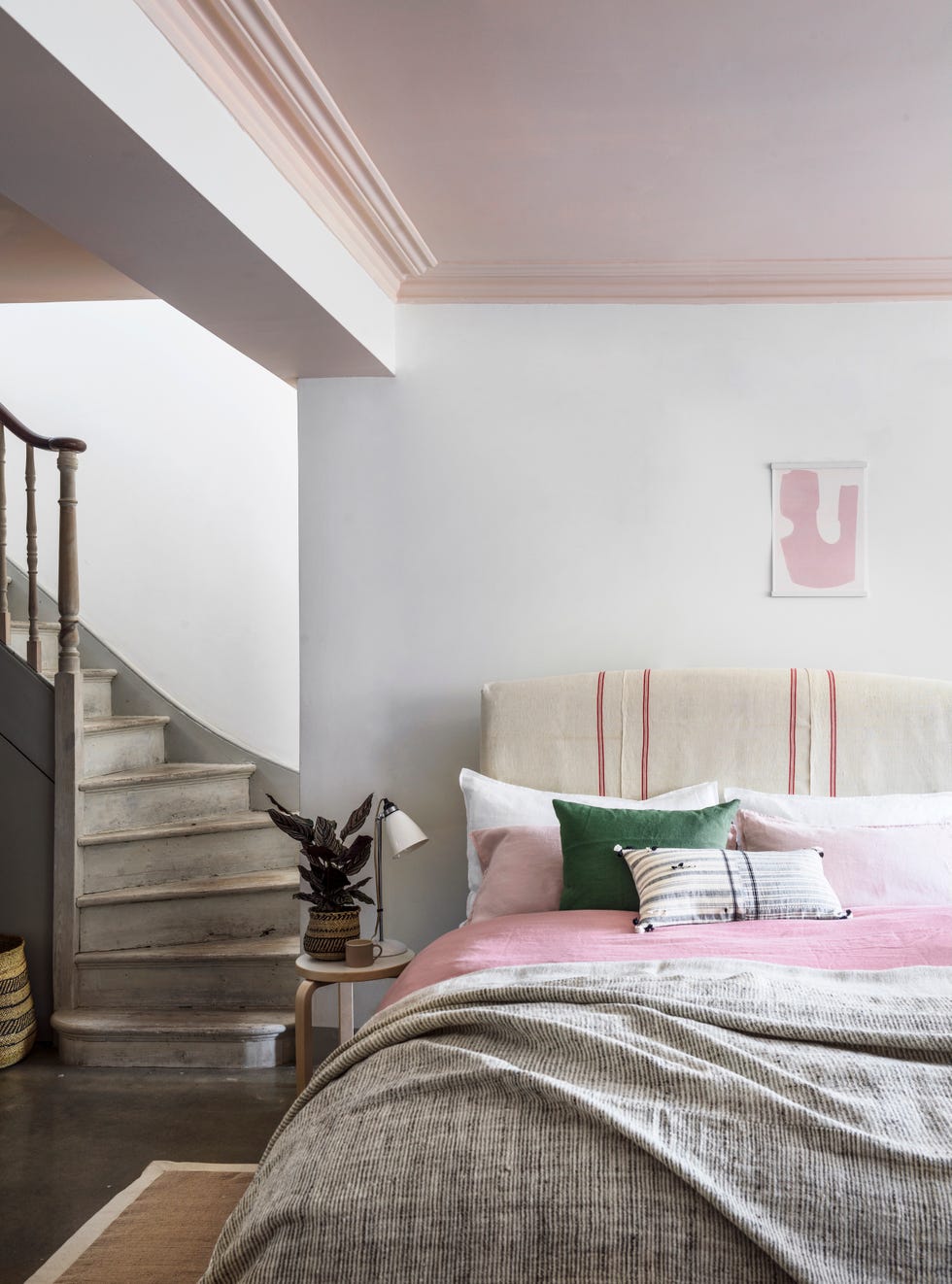 objects of desire staircase leading into a bedroom, double bed. pink and grey bed spreadthe linenwonderfully relaxed and sumptuously soft, quality 100 per cent linen bedding can be pricey. to balance costs, look to the high street for your duvet cover, but go for high quality pillowcases â€“ that way youâ€™ll get the best of both worlds! if you have inherited vintage fabrics, give thema new lease of life by upholstering themonto a chair or headboard washed linen duvet cover, Â£79.99 for a double, hm home. pillowcases, Â£35 each; cushion in laurel, Â£35; rebari cushion, Â£99; cotton border jute rug, Â£275; all the conran shop. desi wool throw, as before. ceiling painted in pink ground, estate emulsion, Â£46.50/2.5l, farrow ball. dahlia double bed frame, from Â£645, button sprung, covered in vintage tea towels. stool 60 by artek, Â£185, the conran shop. hector table light, Â£165, original btc. iringa basket, Â£25;mug, Â£23; both oggetto. and she grew print, Â£30, laurie maun. print frame, from Â£17.99, moxon london