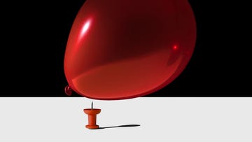 still life concept balloon being popped with pin