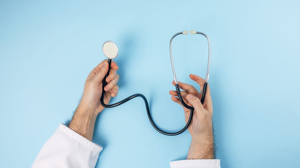 doctors hands holding stethoscope