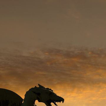 dragon statue on dragon bridge over ljublja