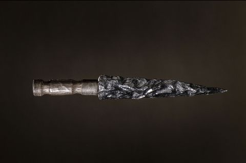 pointed, crude dagger with shiny black blade