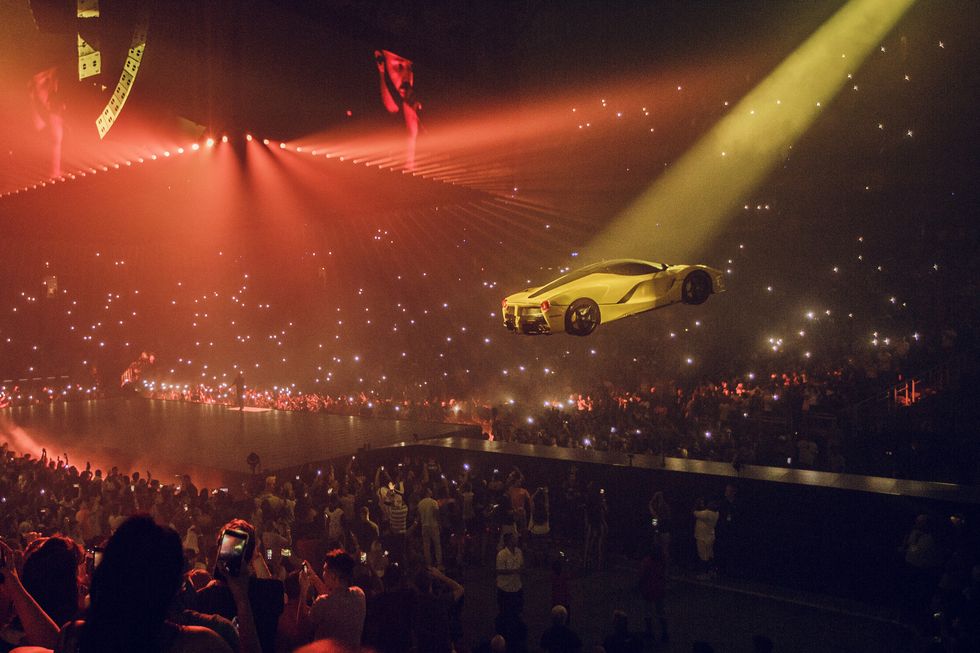 Red, Light, Performance, Crowd, Sky, Event, Night, Luxury vehicle, Performing arts, Car, 