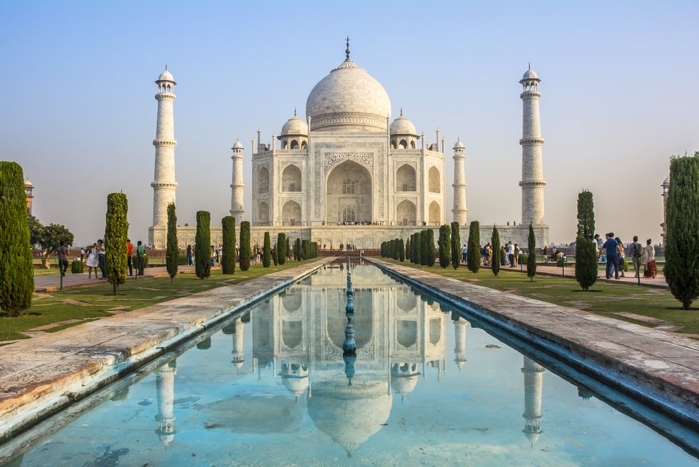 the taj mahal more often meaning crown of the palace is an ivory white marble mausoleum on the south bank of the yamuna river in the indian city of agra