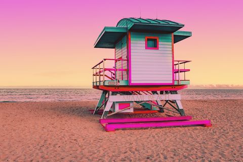dreamlike picture of colorful lifeguard cabin in the miami beach at sunset