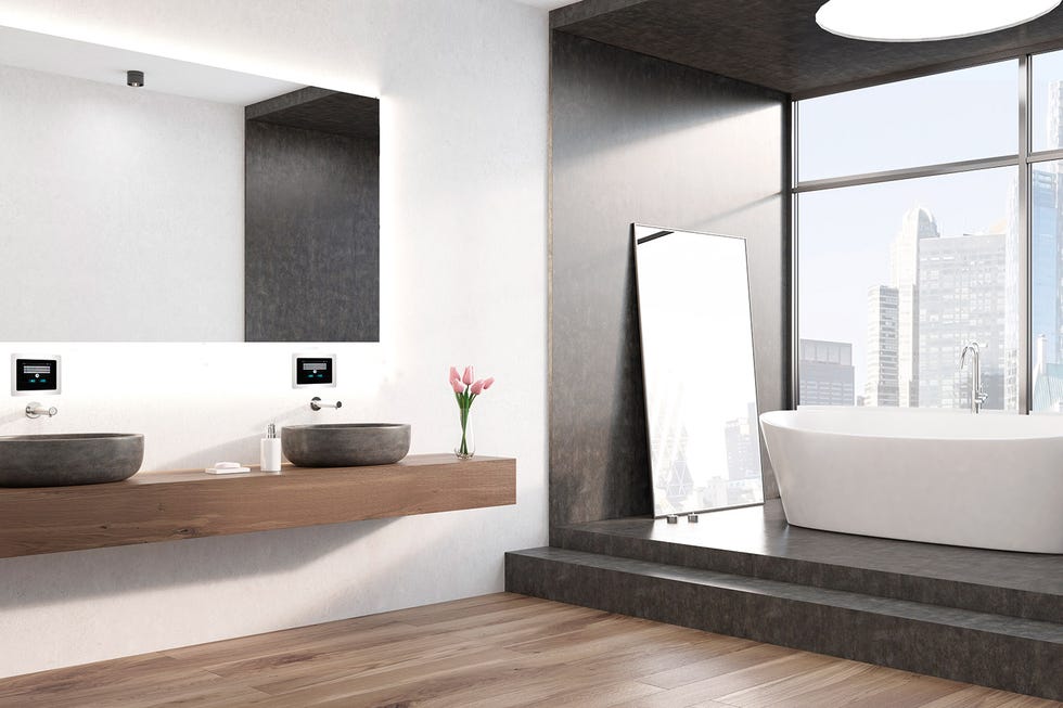 baño moderno con lavabos volados y bañera exenta