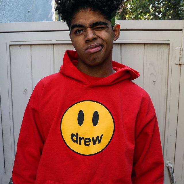 Hoodie, Black, Facial expression, Outerwear, Clothing, Smiley, Red, Smile, Yellow, Emoticon, 
