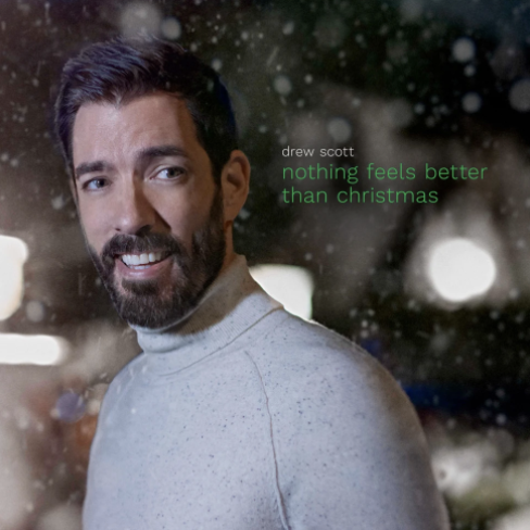 drew scott surrounded by snow next to text with his name and "nothing feels better than christmas"