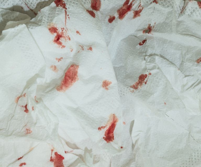 Dried blood on toilet paper background
