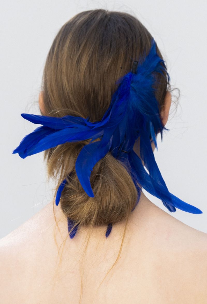 Hair, Blue, Cobalt blue, Hairstyle, Electric blue, Hair accessory, Chin, Feather, Turquoise, Neck, 