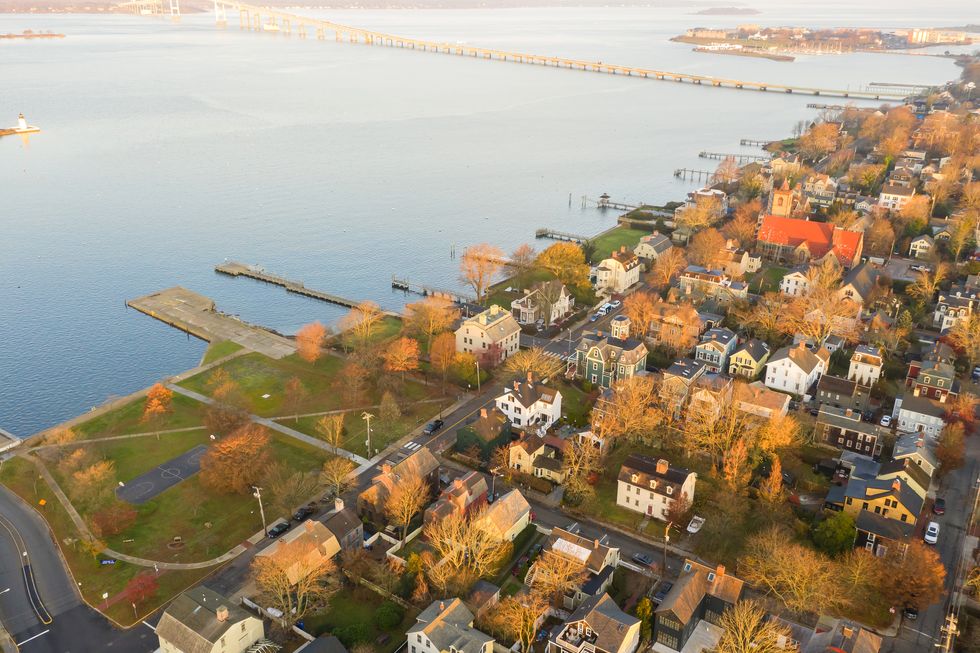 drone aerial view of newport phode island old tradition building with ocean and yatch port with street summer season