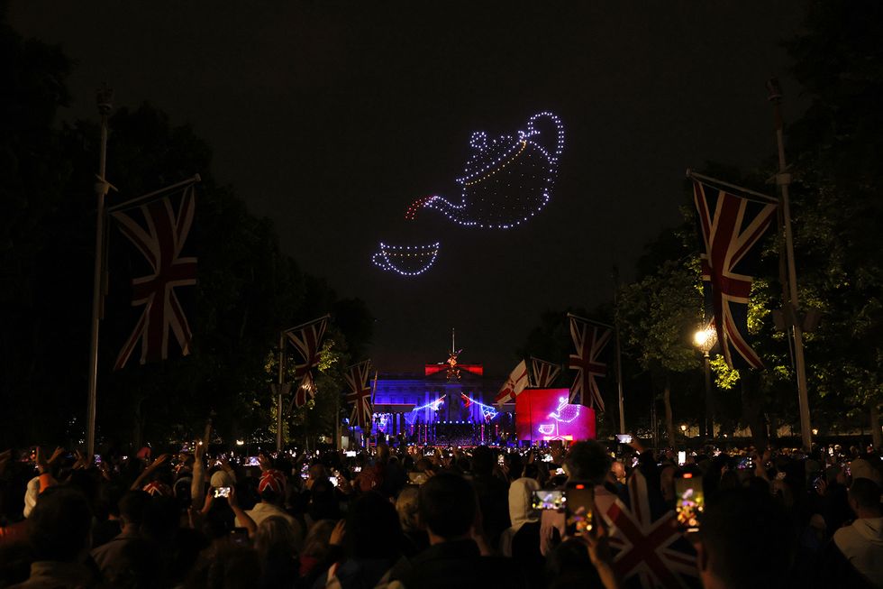 london, england june 04 drones form symbols of celebration over the crowds during the platinum party at the palace concert outside buckingham palace on june 4, 2022 in london, united kingdom the platinum jubilee of elizabeth ii is being celebrated from june 2 to june 5, 2022, in the uk and commonwealth to mark the 70th anniversary of the accession of queen elizabeth ii on 6 february 1952 photo by hollie adamsgetty images