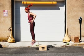 woman doing a rep of a box jump