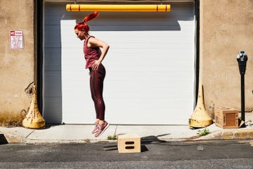 woman doing a rep of a box jump