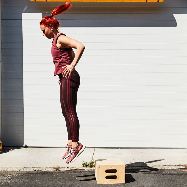woman doing a rep of a box jump