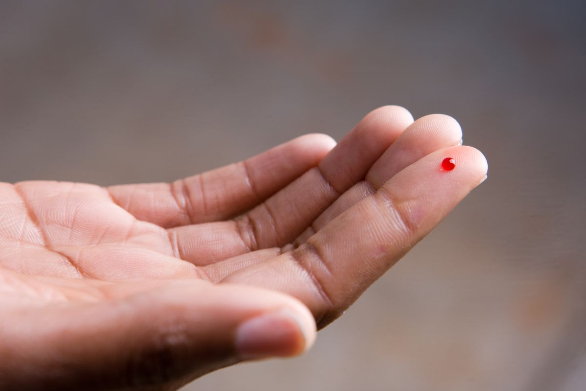 drop of blood on finger