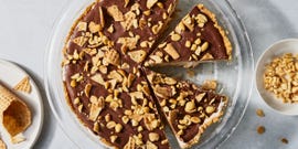 ice cream pie with chocolate ganache, waffle cones and peanuts