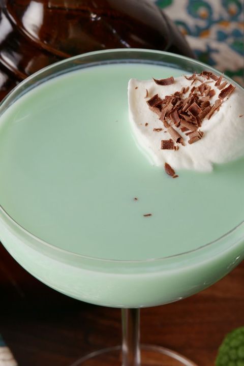 mint cocktail with chocolate shavings and cream on top
