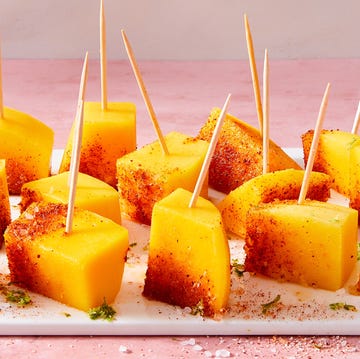 Drunken Tequila Mangos mango pieces soaked in tequila and topped with chili powder
