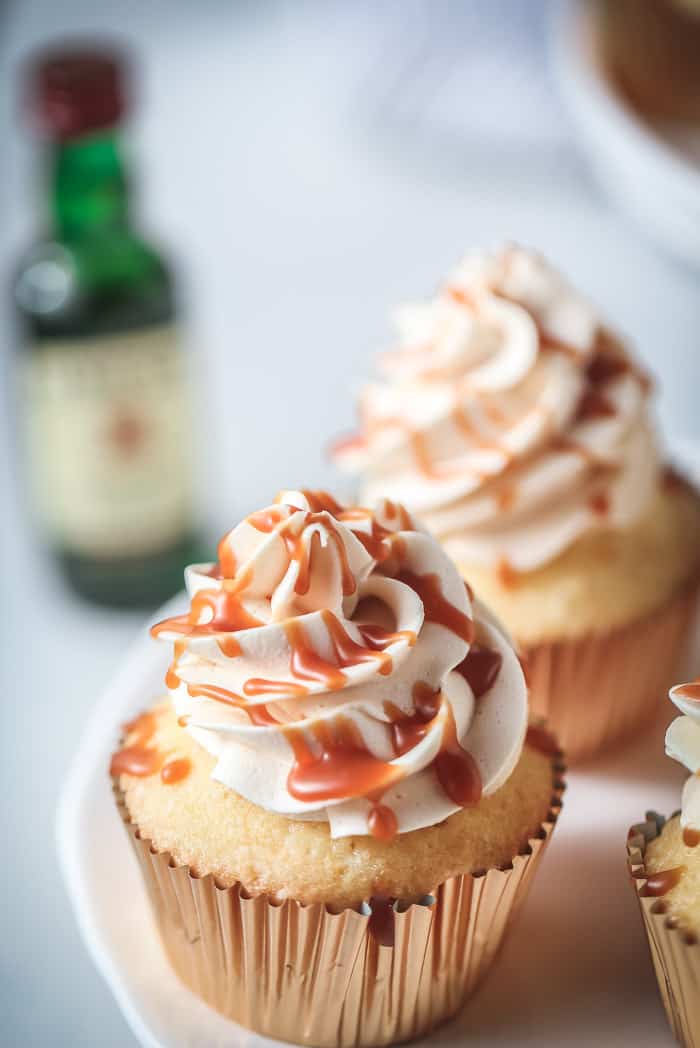 whiskey caramel cupcakes with drizzle of caramel on top