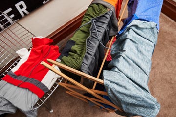 hanging clothes on a drying rack