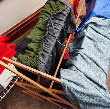 hanging clothes on a drying rack hanging clothes on a drying rack
