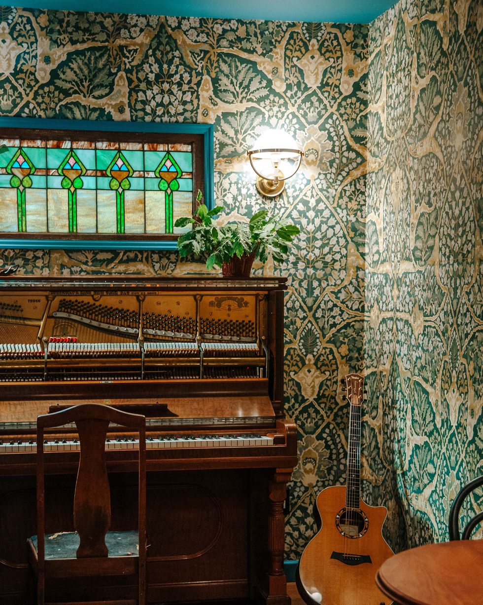 music room, green floral wallpaper, piano
