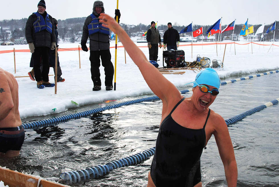 the author emerges from the icy water ecstatic after completing her first frigid race