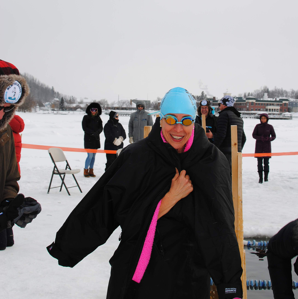 the author smiles post race as volunteers work to ensure she warms back up safely