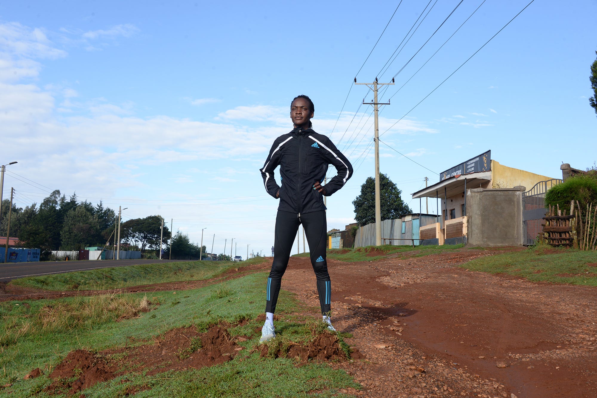 a man walking on a dirt road