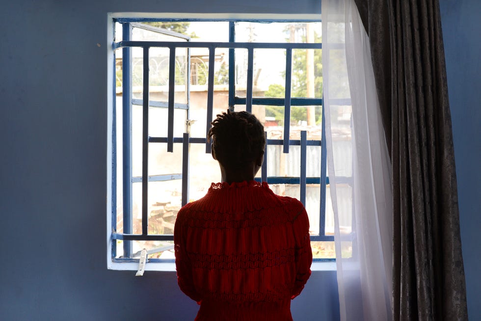 a person looking out a window