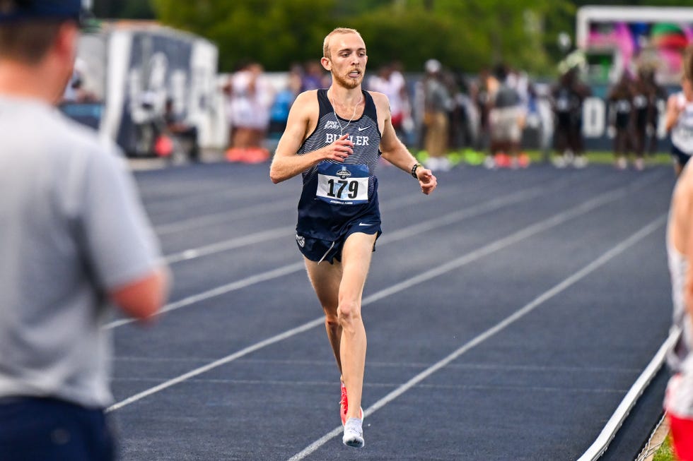 runner on the track finishing with one shoe