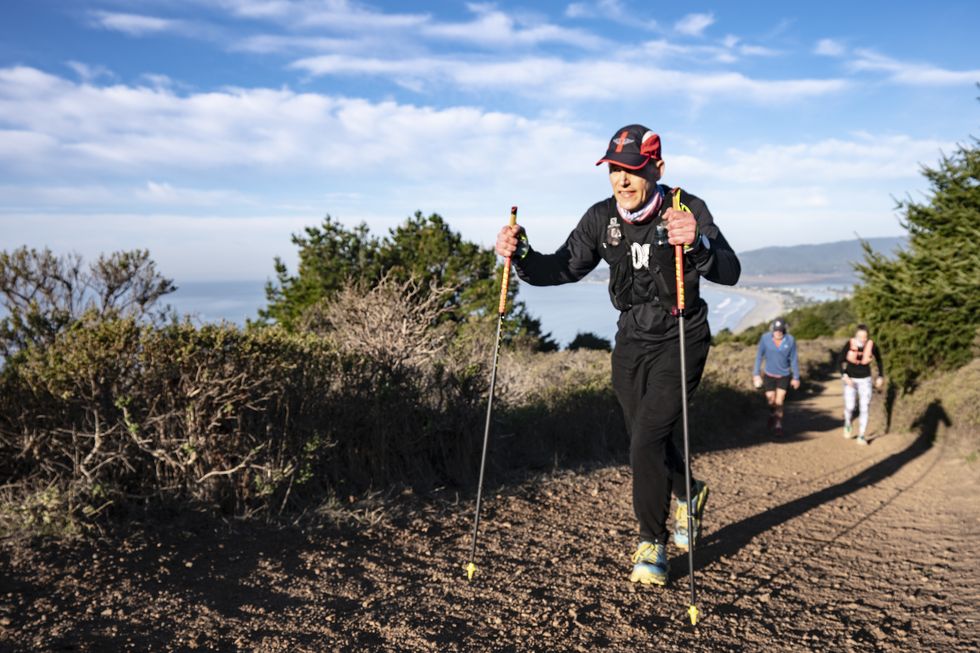 bradley fenner hiking up the dipsea trail during his quad quad dipsea