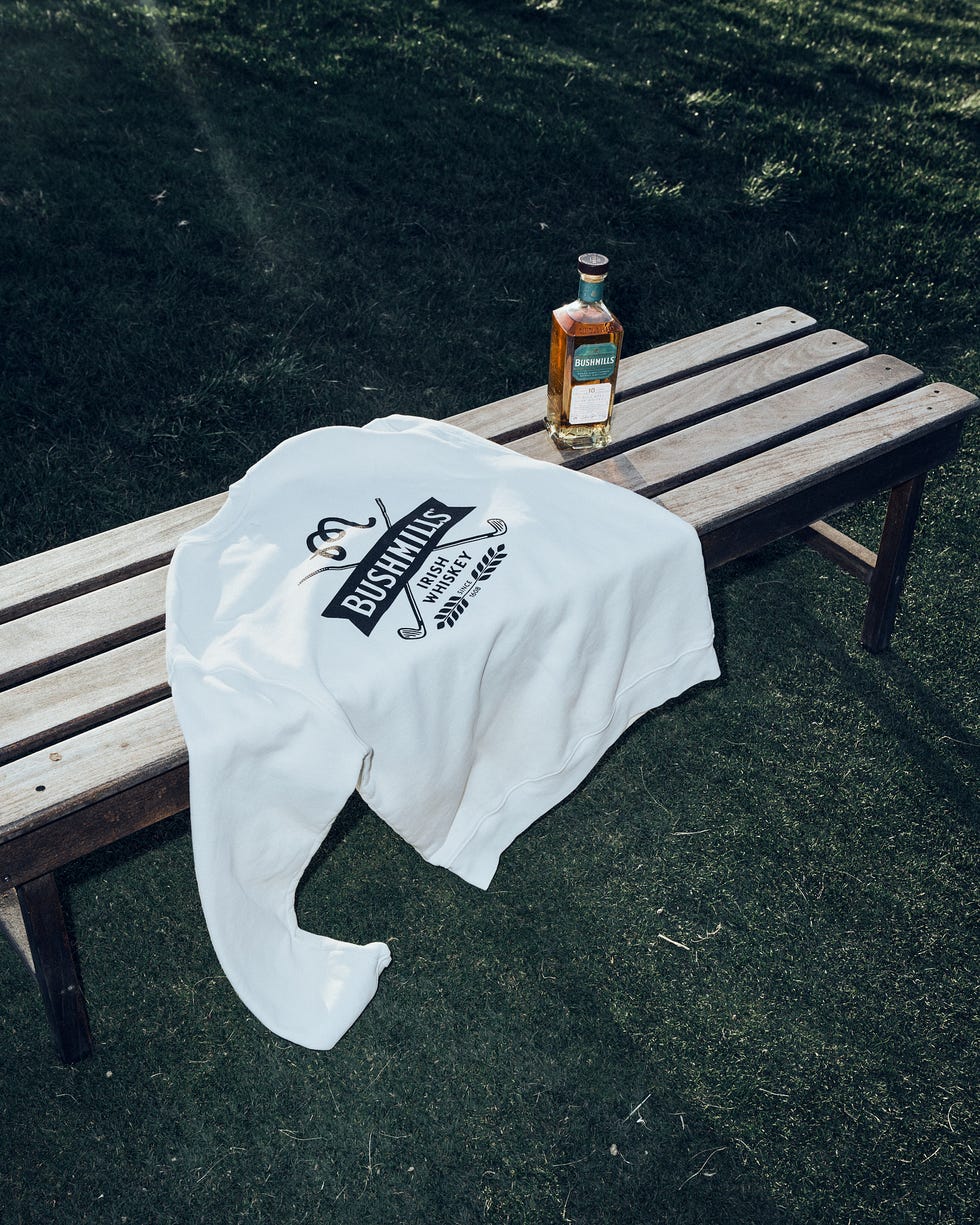 a bottle of beer on a picnic table