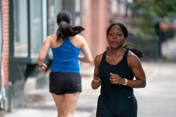 two women running in opposite directions