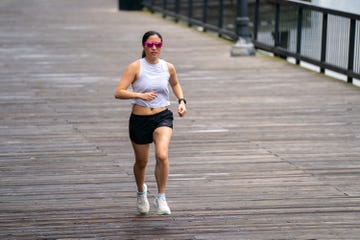 woman running on boardwalk