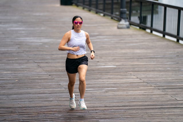 woman running on boardwalk