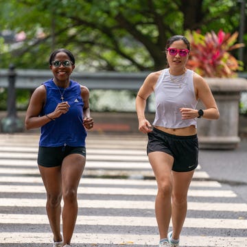 two women looking happy running two women looking happy running