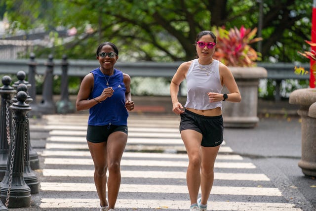 two women looking happy running