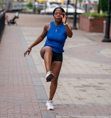 runner warming up on a walkway runner warming up on a walkway