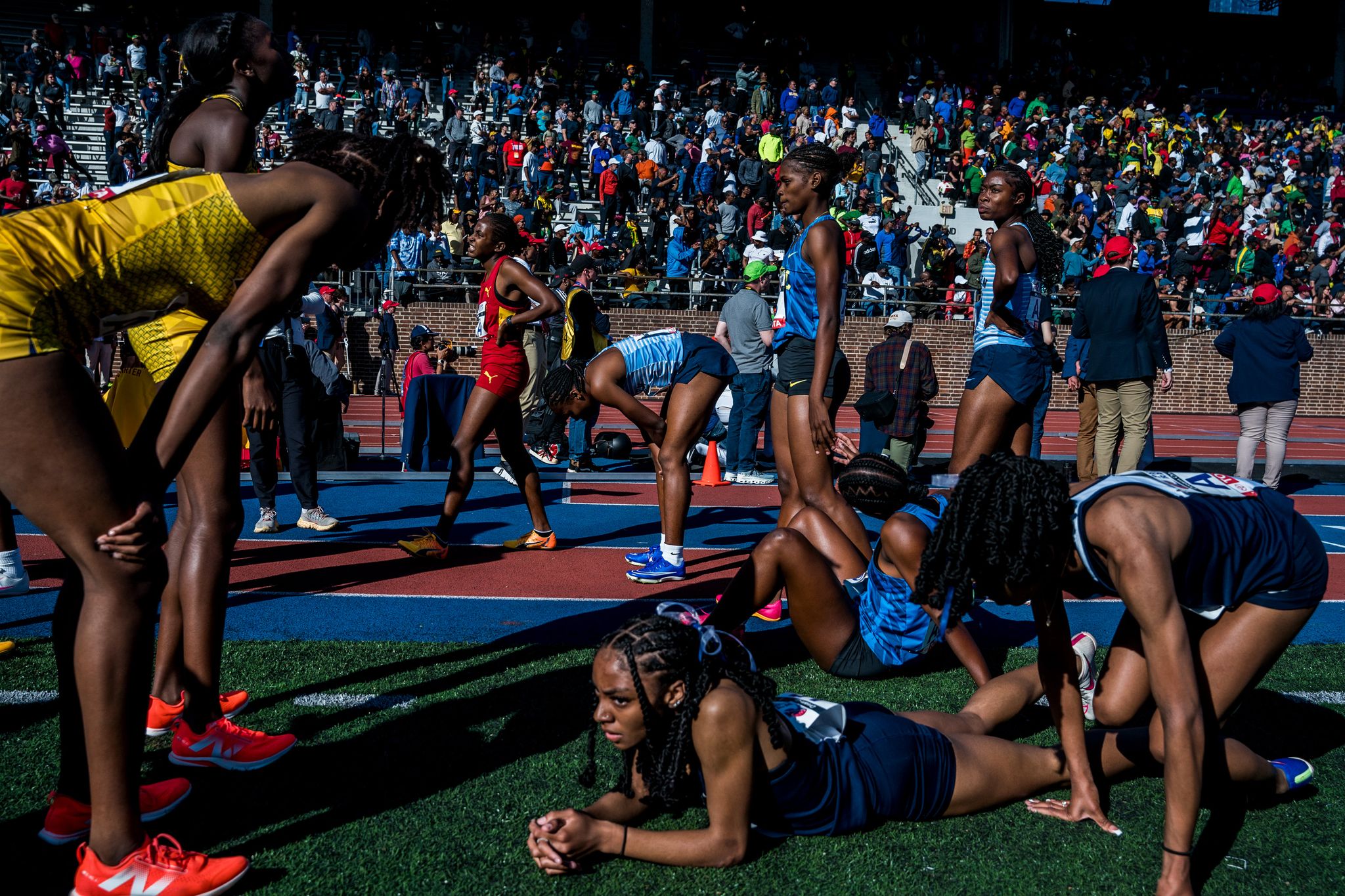 athletes catch their breath after a running race