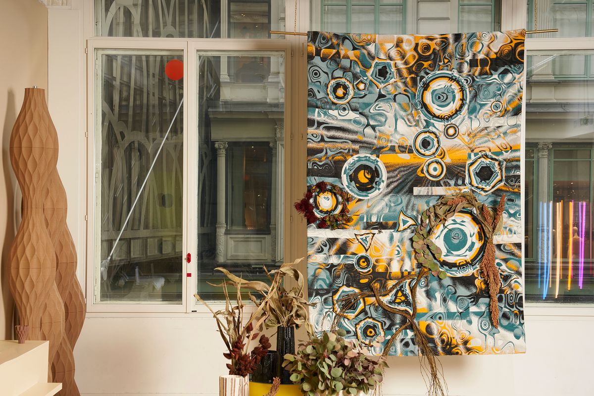 a tapestry next to a window