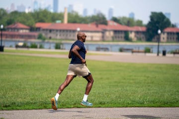runner's world magazine man running in liberty state park, nj african american man running outside
