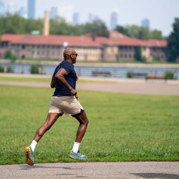 runner's world magazine man running in liberty state park, nj african american man running outside runner's world magazine man running in liberty state park, nj african american man running outside
