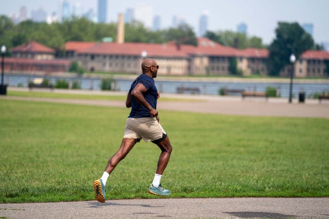 runner's world magazine man running in liberty state park, nj african american man running outside