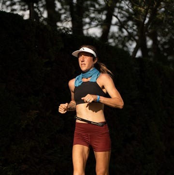 a person running along a paved path a person running along a paved path